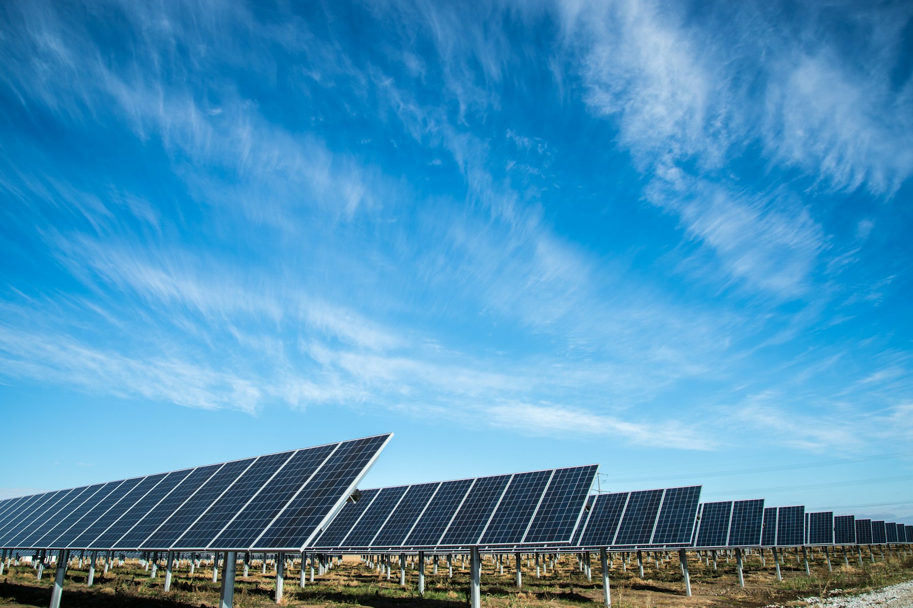 Solar panels beneath an open sky